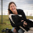 Jo-Anne McArthur laughs while playing with Orlando the cow.