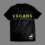 Picture of a black shirt against a grey background. The shirt has green text that says "Vegans" and white text below that says "We don't just eat like rabbits". In the bottom of the shirt, there are two small rabbits just above the words "T.O.F.U. Magazine"