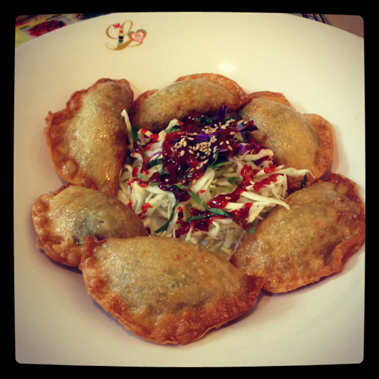 Image contains a photo of a number of fried dumplings in a bowl.