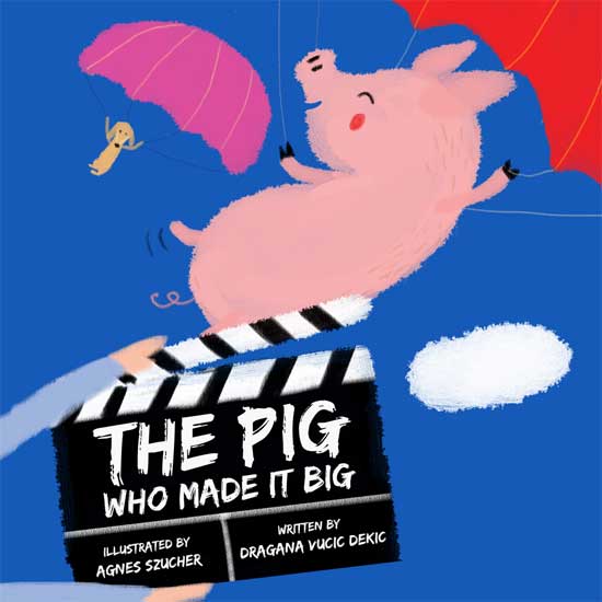 Image contains an illustration of a pig and a small dog dropping from the sky with parachutes. Below the animals, there is a movie clapboard that says "The Pig Who Made it Big" in white chalk letters. Below this, and to the left on the board, similar coloured text says "Illustrated by Agnes Szucher". To the right of this, there is text that says "Written by Dragana Vucic Dekic".