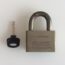 Image contains a photo of a small padlock with a key placed next to it.