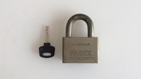 Image contains a photo of a small padlock with a key placed next to it.