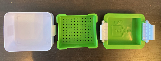 Three pieces of the Tofuture tofu press.